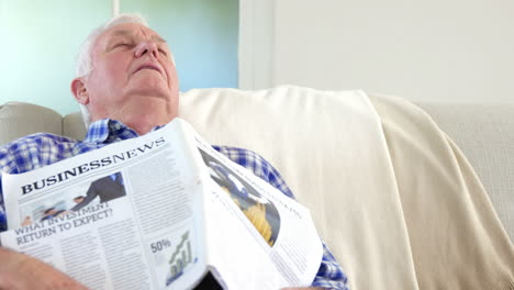 Senior-man-sleeping-with-newspaper-on-him
