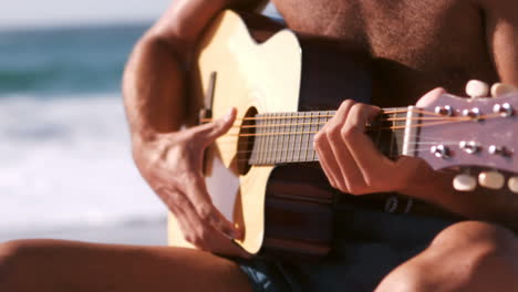 A-man-is-playing-with-his-guitar