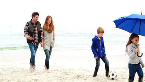 Family-walking-on-the-beach