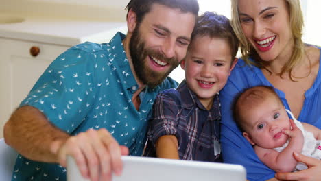 Family-looking-at-the-tablet-computer