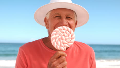 Mature-man-eating-a-lollipop