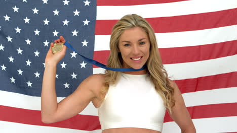 Woman-smiling-with-medal-in-hands
