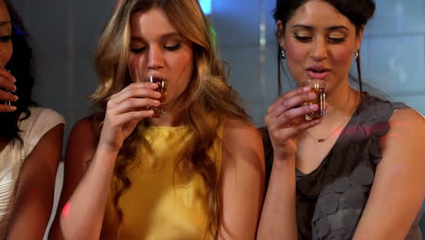 Cute-friends-having-shots-at-a-party