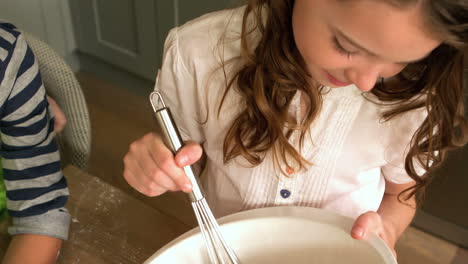 Cute-girl-preparing-a-cake