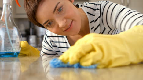 Woman-cleaning-counter