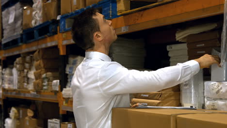 Supervisor-checking-products-at-warehouse