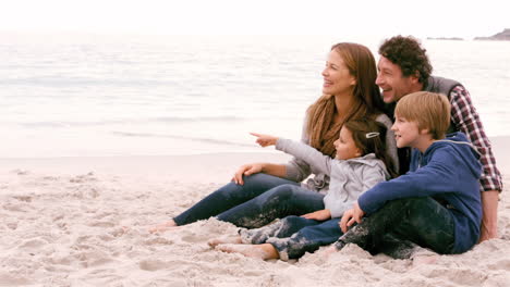 Family-sitting-and-pointing