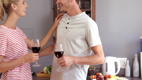 Couple-drinking-red-wine-while-cooking
