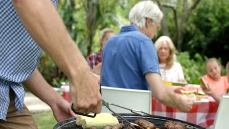 Happy-family-doing-barbecue-together