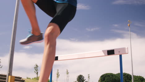 Sportswoman-doing-hurdle-race