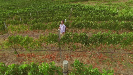Drone-footage-of-man-drinking-red-wine