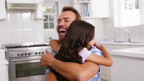 Daughter-giving-a-hug-to-her-happy-father