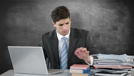 Worried-businessman-using-laptop