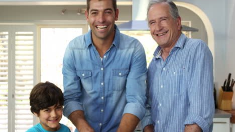 Family-cutting-vegetables-together