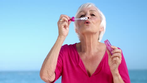 Senior-woman-making-bubbles