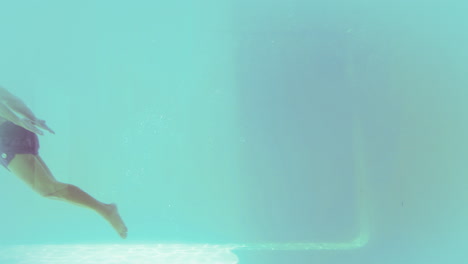 Handsome-man-swimming-underwater