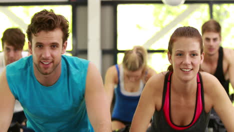 Fit-group-of-people-using-exercise-bike-together