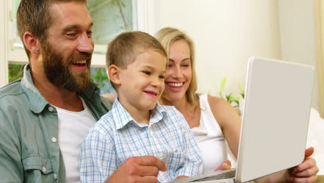 Parent-and-his-son-looking-at-tablet-computer-