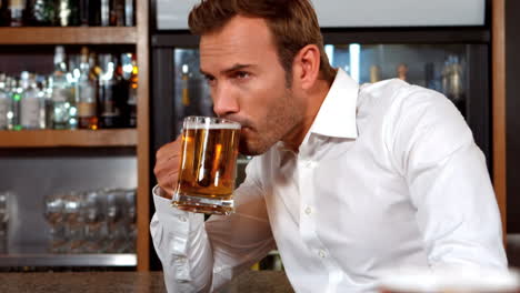 Businessman-drinking-a-glass-of-beer-