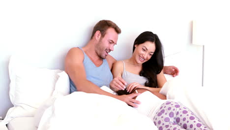Cute-girl-jumping-in-parents-bed