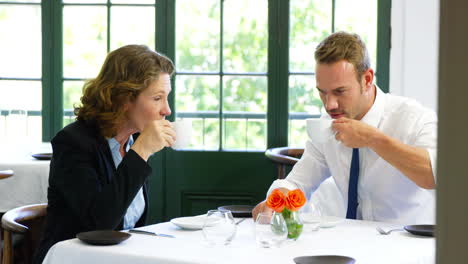 Business-team-having-a-meeting-in-restaurant