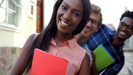 Hipster-students-are-smiling-and-holding-copybook