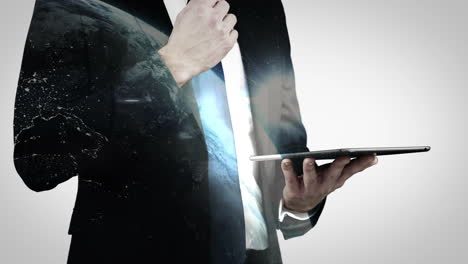 Businessman-using-digital-tablet-with-globe-overlay