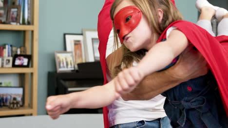 Father-and-daughter-pretending-to-be-superhero