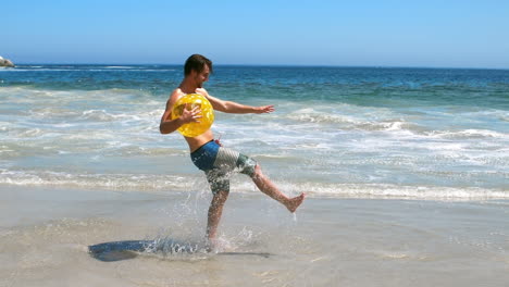 Man-holding-beach-ball