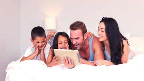 Happy-family-using-tablet