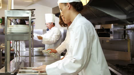 Team-of-chef-cleaning-the-kitchen