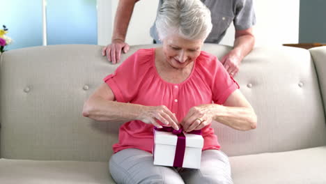 Old-woman-opening-her-gift