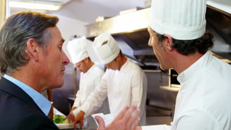Man-and-chef-discussing