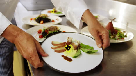 Chefs-taking-dishes-from-counter