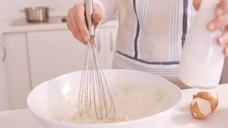 Woman-baking-with-egg-and-flour