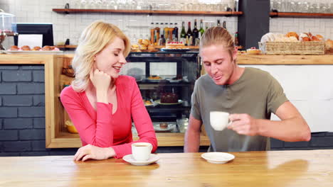 Couple-talking-and-drinking-coffee