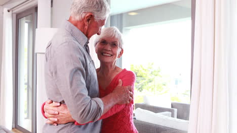 Cute-senior-couple-hugging