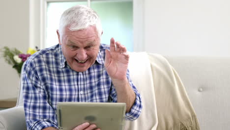 Old-man-using-video-chat-on-tablet