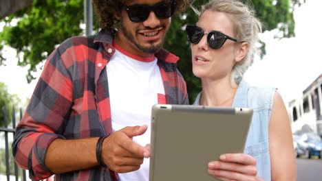 Friends-using-digital-tablet