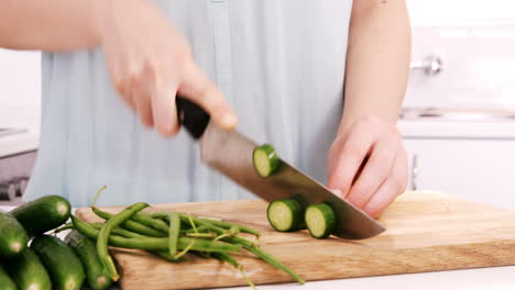 Woman-cutting-courgette-