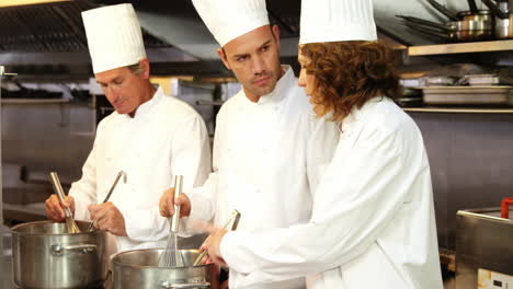 Group-of-chef-talking-and-cooking
