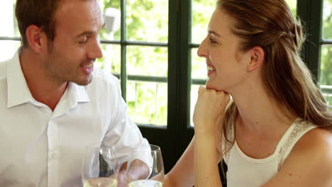 Cute-couple-having-a-glass-of-wine