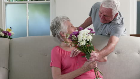 Old-man-surprising-his-wife-with-gifts