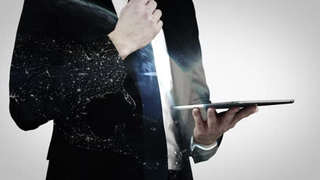 Businessman-using-digital-tablet-with-globe-overlay