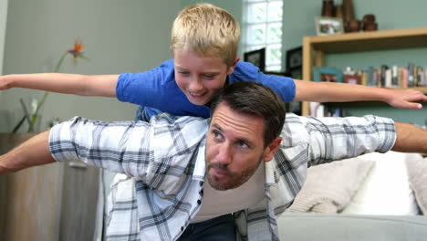 Happy-father-and-son-playing-together