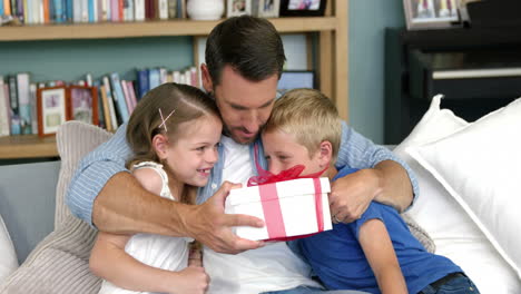 Father-receiving-a-gift-from-his-children
