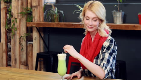 Woman-drinking-green-milkshake