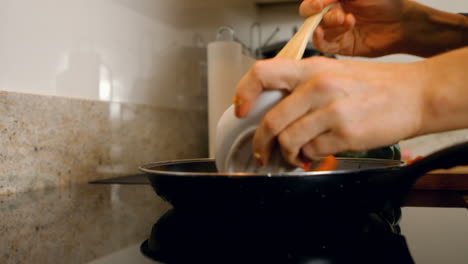 Woman-cooking-paprika