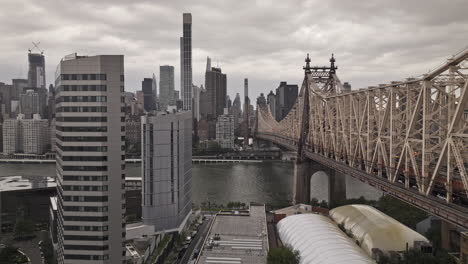 NYC-New-York-Aerial-v319-drone-flyover-East-river-and-Roosevelt-island-along-Queensboro-bridge-towards-East-Side-of-Manhattan-capturing-urban-cityscape---Shot-with-Mavic-3-Pro-Cine---September-2023