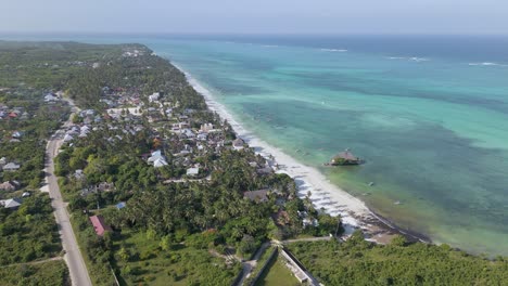 Zanzibar-beach-strip-with-The-Rock-restaurant-in-sunset-casting-shadows